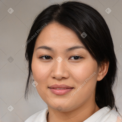 Joyful asian young-adult female with medium  black hair and brown eyes