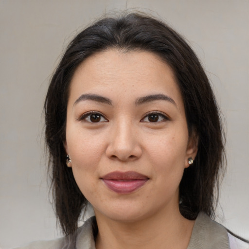 Joyful white young-adult female with medium  brown hair and brown eyes