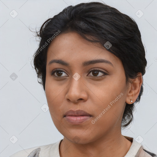 Joyful latino young-adult female with medium  brown hair and brown eyes