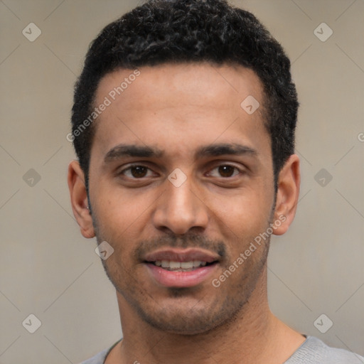 Joyful white young-adult male with short  black hair and brown eyes