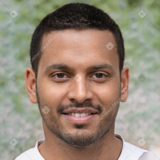 Joyful latino young-adult male with short  brown hair and brown eyes