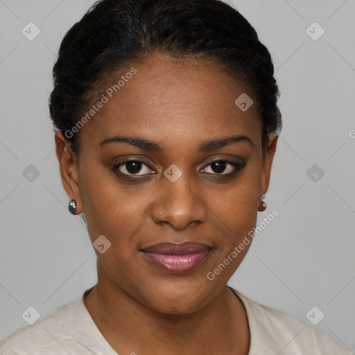 Joyful black young-adult female with short  black hair and brown eyes