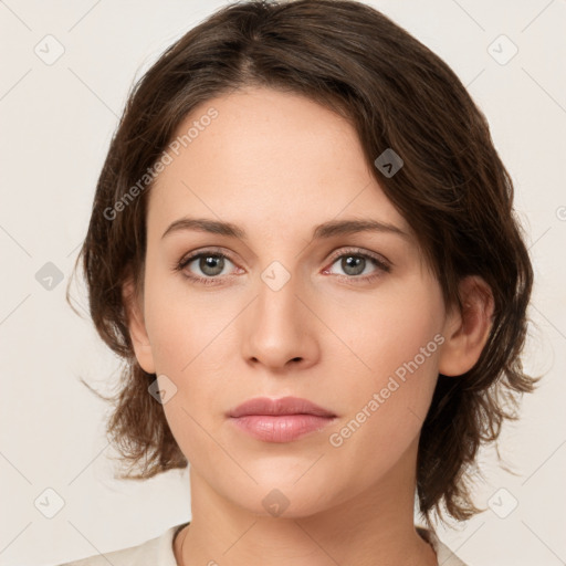 Neutral white young-adult female with medium  brown hair and green eyes