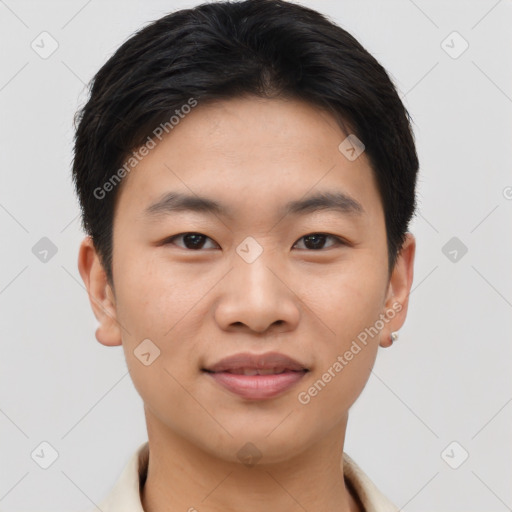 Joyful asian young-adult male with short  brown hair and brown eyes