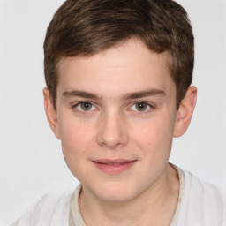 Joyful white child male with short  brown hair and brown eyes