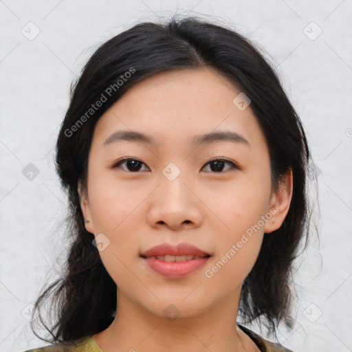 Joyful asian young-adult female with medium  black hair and brown eyes