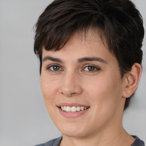 Joyful white young-adult female with medium  brown hair and brown eyes