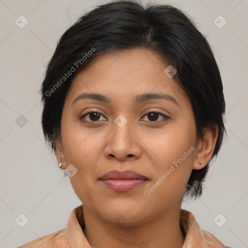 Joyful latino young-adult female with medium  brown hair and brown eyes