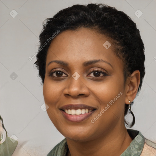 Joyful latino young-adult female with long  black hair and brown eyes