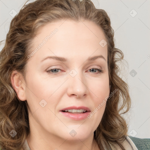 Joyful white young-adult female with medium  brown hair and blue eyes