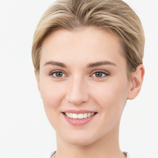 Joyful white young-adult female with short  brown hair and grey eyes