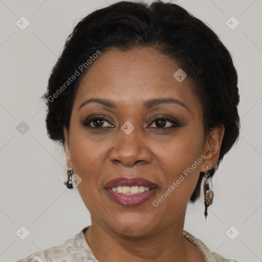 Joyful black adult female with medium  brown hair and brown eyes