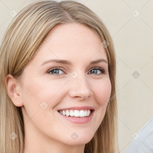 Joyful white young-adult female with long  brown hair and green eyes