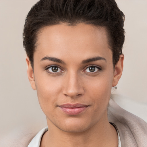 Joyful white young-adult female with short  brown hair and brown eyes