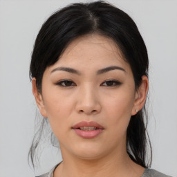 Joyful asian young-adult female with medium  black hair and brown eyes