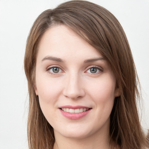 Joyful white young-adult female with long  brown hair and grey eyes