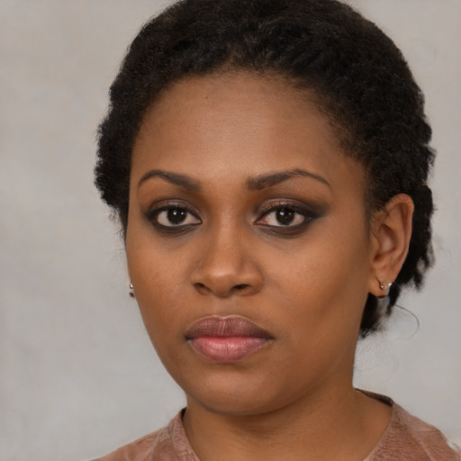 Neutral black young-adult female with medium  black hair and brown eyes