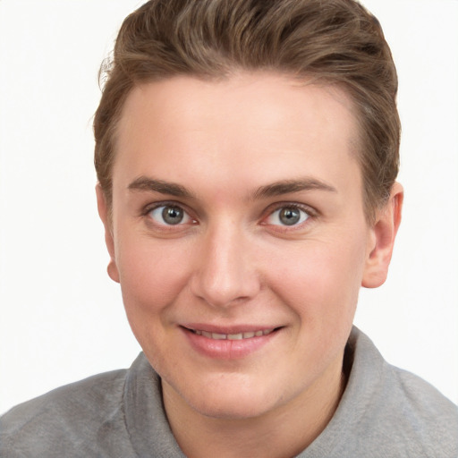 Joyful white young-adult female with short  brown hair and grey eyes