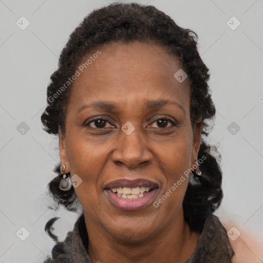 Joyful black adult female with short  brown hair and brown eyes