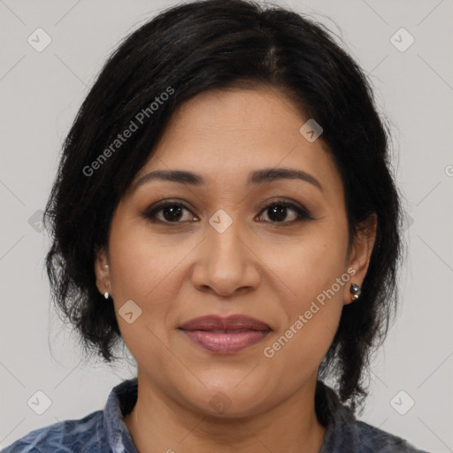 Joyful latino adult female with medium  brown hair and brown eyes