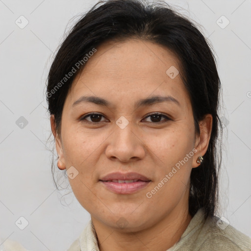 Joyful asian adult female with medium  brown hair and brown eyes