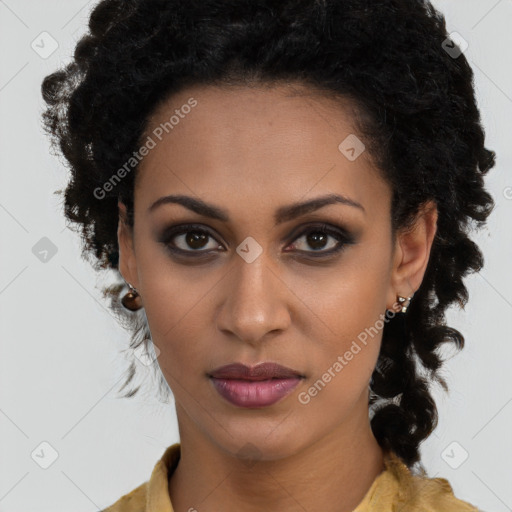 Joyful black young-adult female with long  brown hair and brown eyes