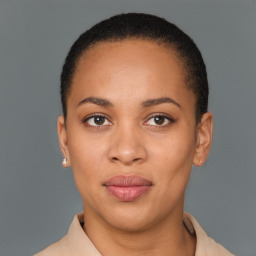 Joyful black young-adult female with short  brown hair and brown eyes