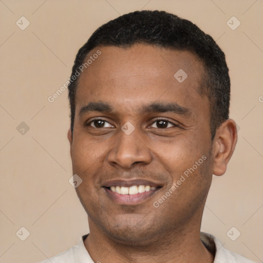 Joyful latino young-adult male with short  black hair and brown eyes