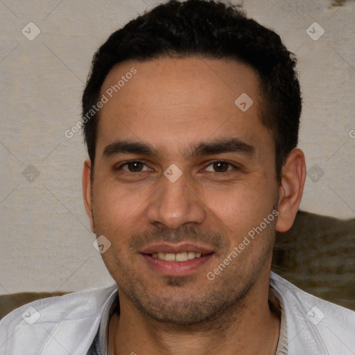 Joyful white young-adult male with short  black hair and brown eyes