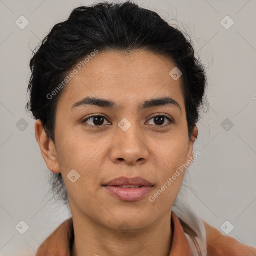 Joyful latino adult female with medium  brown hair and brown eyes