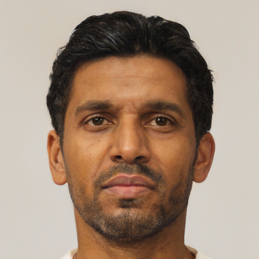 Neutral latino adult male with short  brown hair and brown eyes