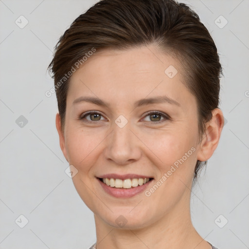 Joyful white young-adult female with short  brown hair and brown eyes