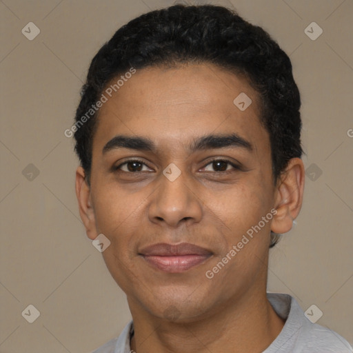 Joyful black young-adult male with short  black hair and brown eyes