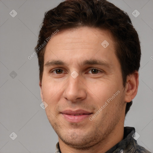 Joyful white adult male with short  brown hair and brown eyes