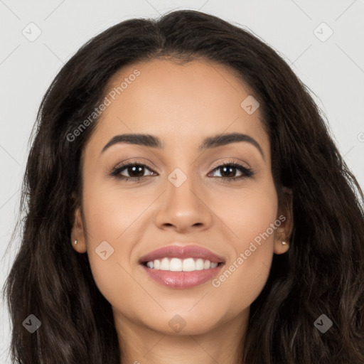 Joyful latino young-adult female with long  brown hair and brown eyes