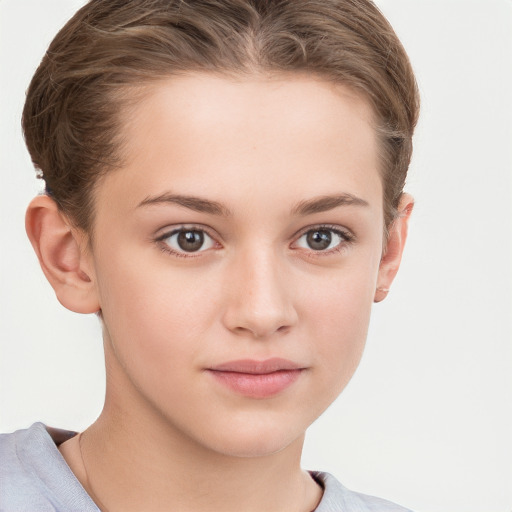 Joyful white child female with short  brown hair and grey eyes