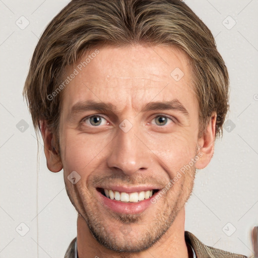 Joyful white adult male with short  brown hair and grey eyes