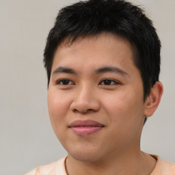 Joyful asian young-adult male with short  brown hair and brown eyes