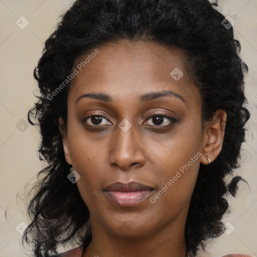 Joyful black young-adult female with medium  brown hair and brown eyes