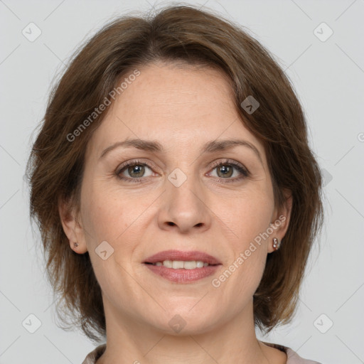 Joyful white adult female with medium  brown hair and brown eyes