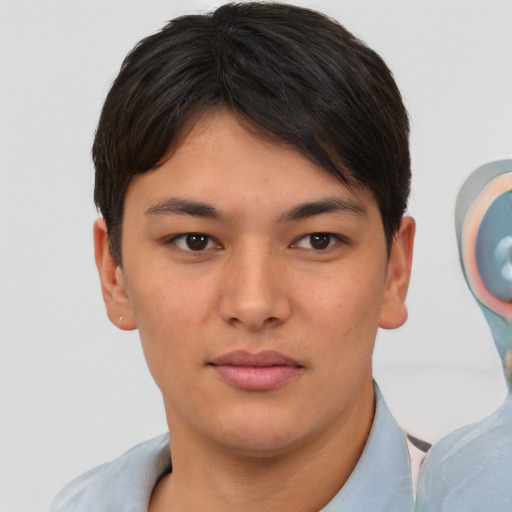 Joyful asian young-adult male with short  brown hair and brown eyes