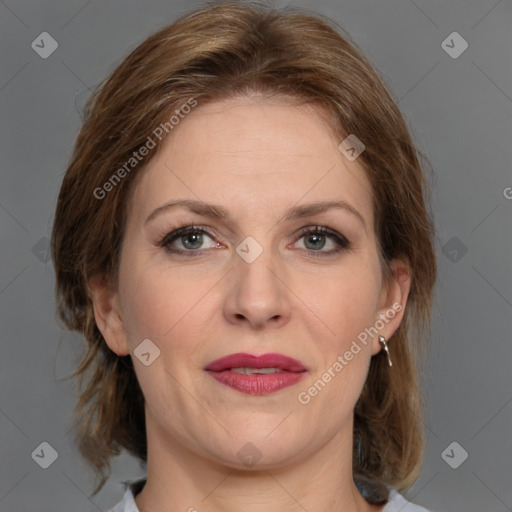 Joyful white adult female with medium  brown hair and grey eyes