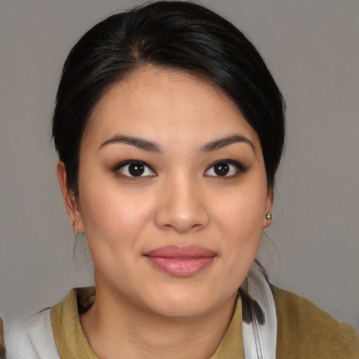Joyful asian young-adult female with medium  brown hair and brown eyes