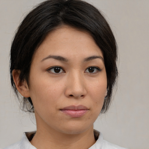 Neutral asian young-adult female with medium  brown hair and brown eyes