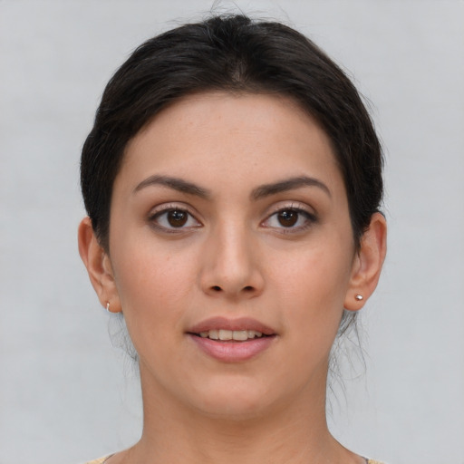 Joyful white young-adult female with short  brown hair and brown eyes