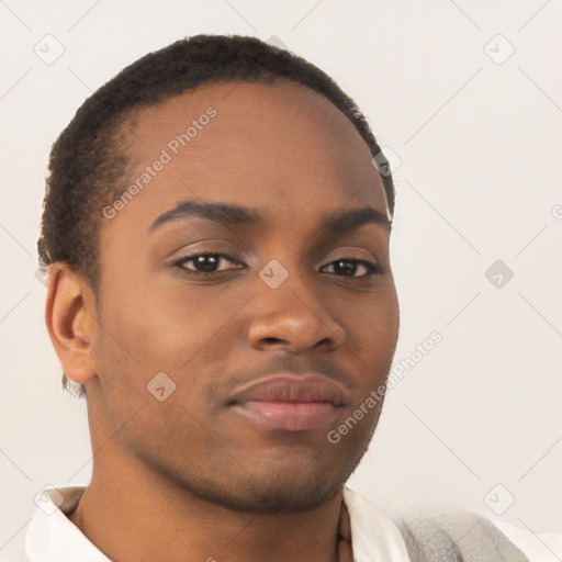 Joyful black young-adult male with short  brown hair and brown eyes