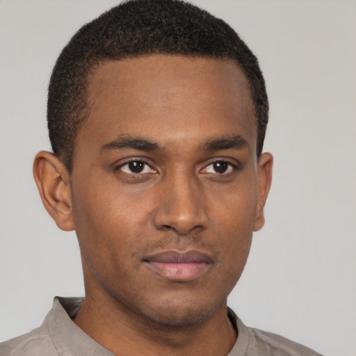 Neutral latino young-adult male with short  brown hair and brown eyes