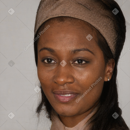 Joyful black adult female with long  black hair and brown eyes