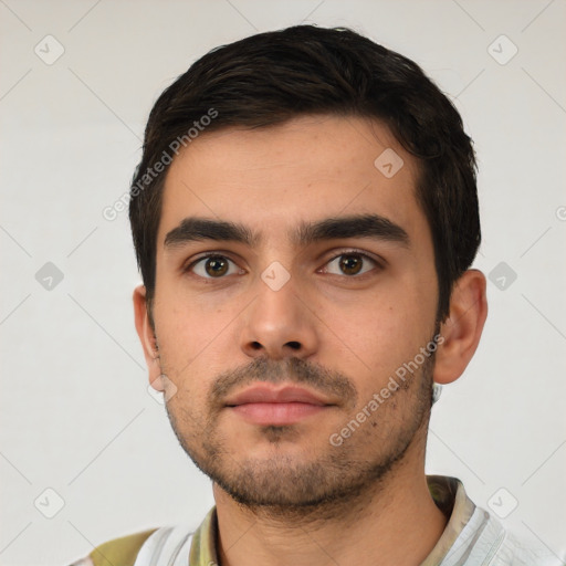 Neutral white young-adult male with short  brown hair and brown eyes