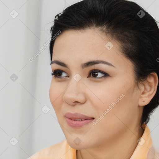 Joyful latino young-adult female with medium  brown hair and brown eyes